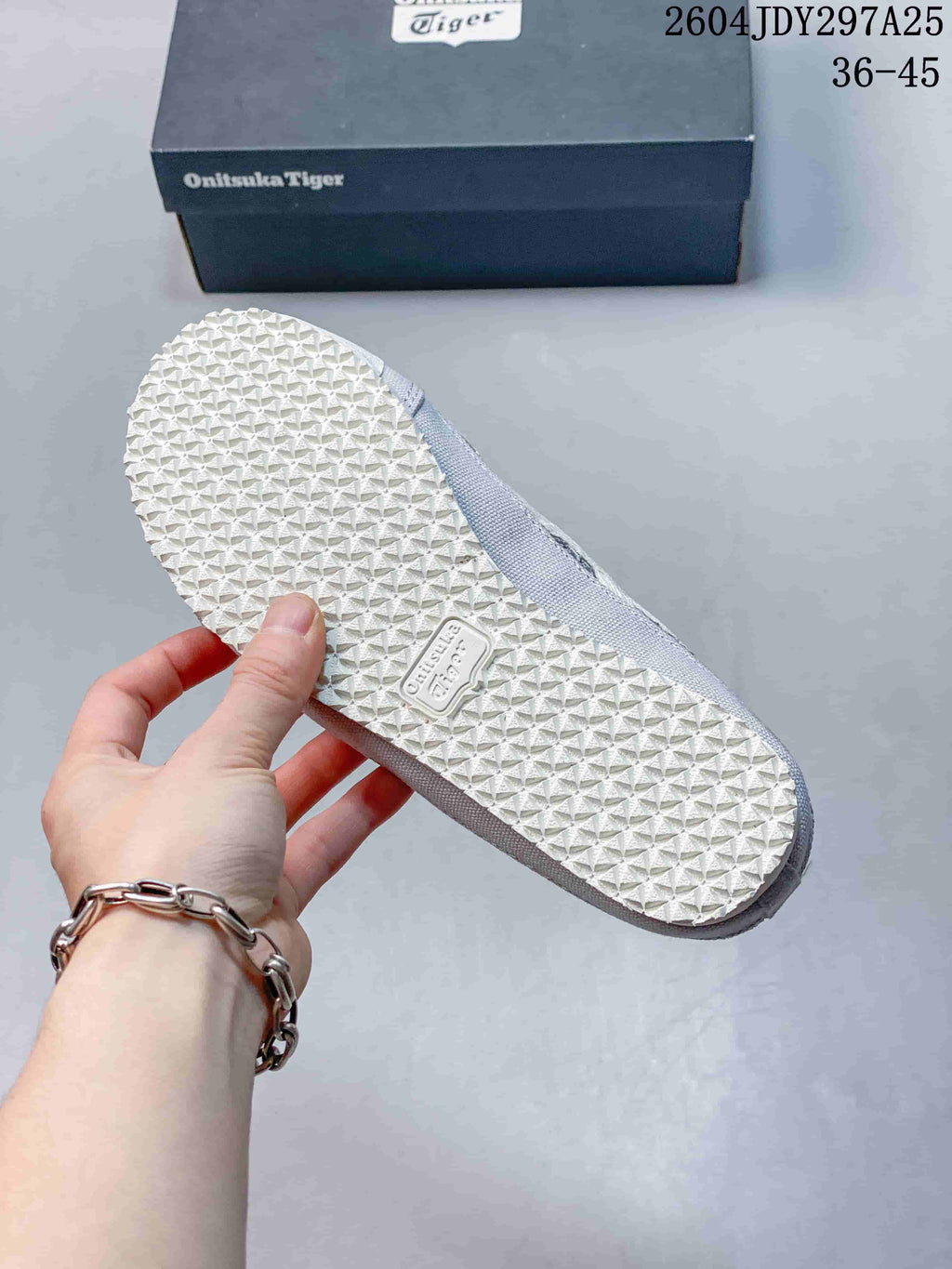 White patterned rubber outsole of an Onitsuka Tiger Mexico 66 Sabot sneaker.