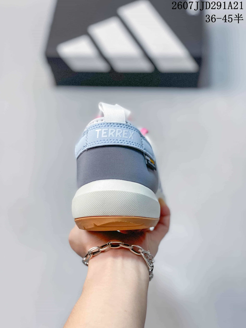 Rear view showing the padded dark heel panel, white heel pull tab and TERREX branding.