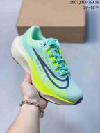 Mint-colored Nike Zoom Fly 5 PRM sneaker with dark branding, bright green lace details and a neon sole.