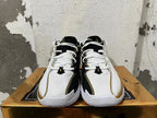 Front view highlighting the perforated uppers and white laces