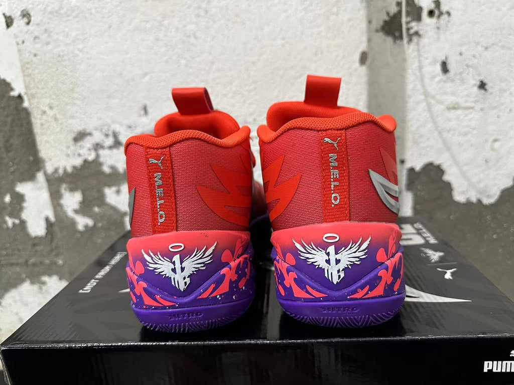 Rear view of red Puma Melo basketball shoes with purple graphic heels and white winged emblems.