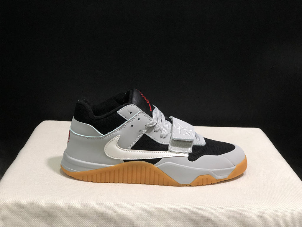 Opposite lateral view showing the black toe panel, white overlays, side Swoosh, and gum-colored outsole.