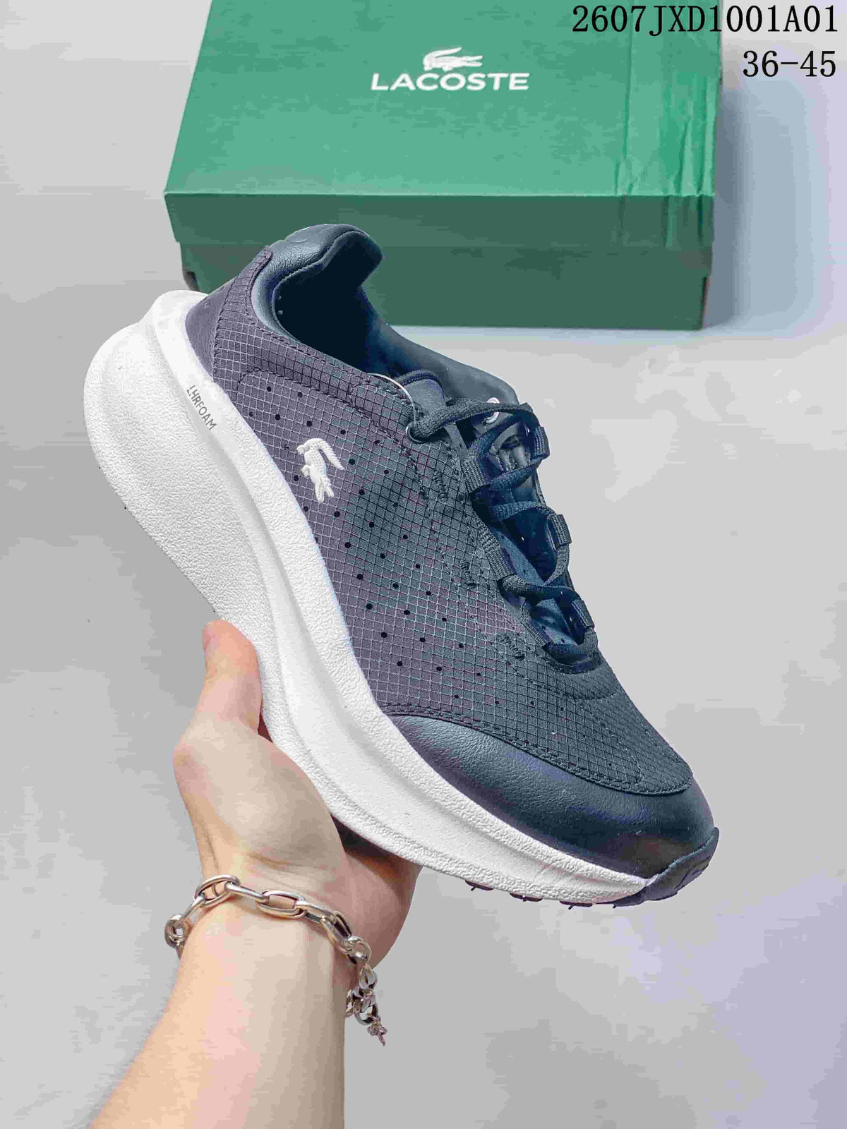 Navy Lacoste lace-up sneaker with white sole and side crocodile emblem