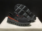 Angled view of the sneakers with one shoe tilted to show the textured outsole and its segmented openings.