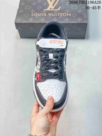 Front view of a sneaker with dotted laces and perforated toe panel
