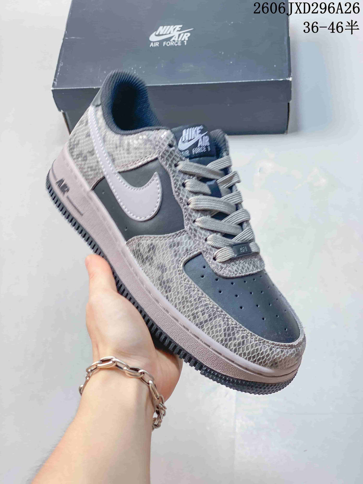 Close-up of a charcoal Nike Air Force 1 sneaker with patterned panels and a light Swoosh.