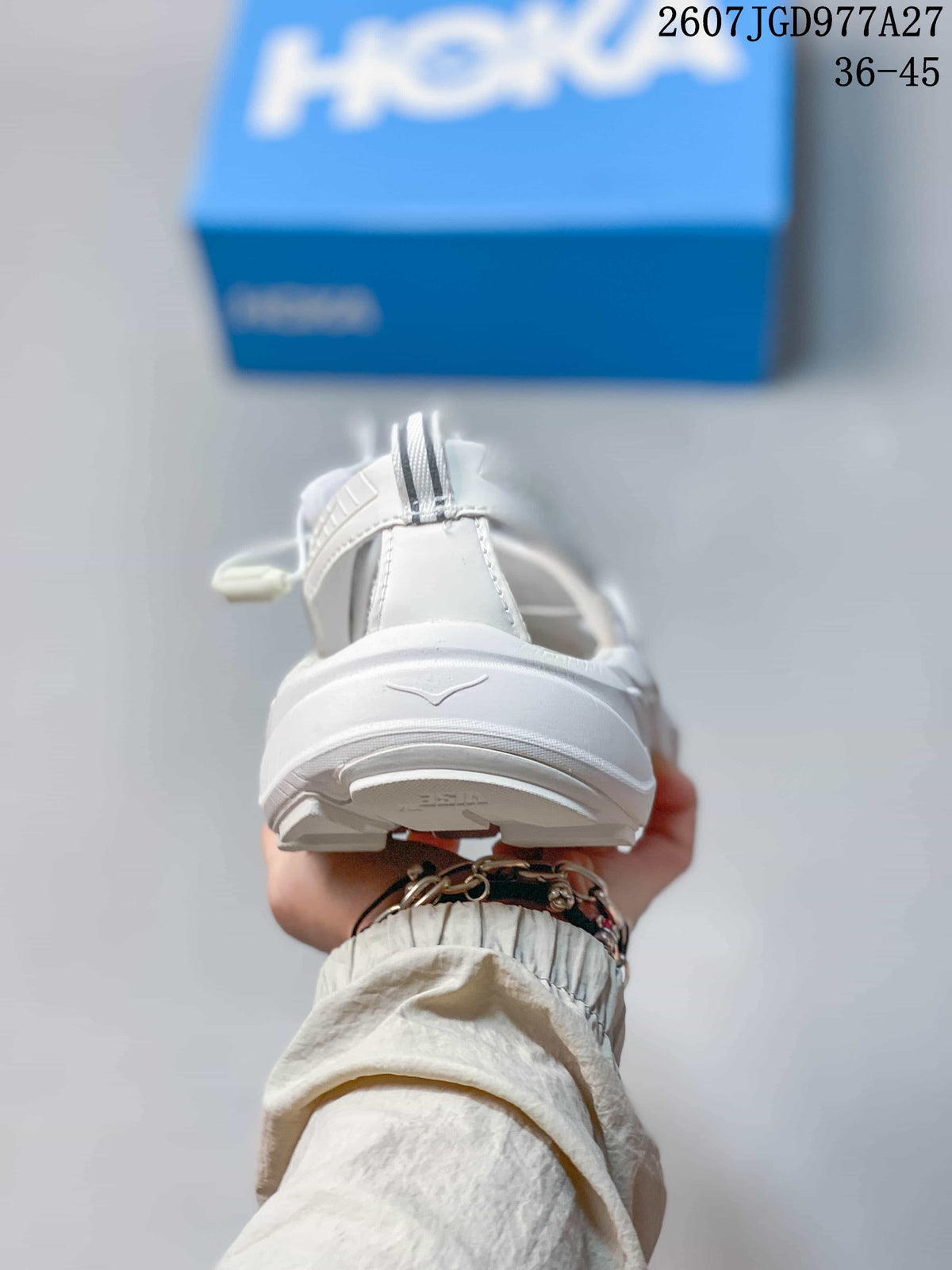Rear view of the white sandal showing the heel strap and layered outsole.
