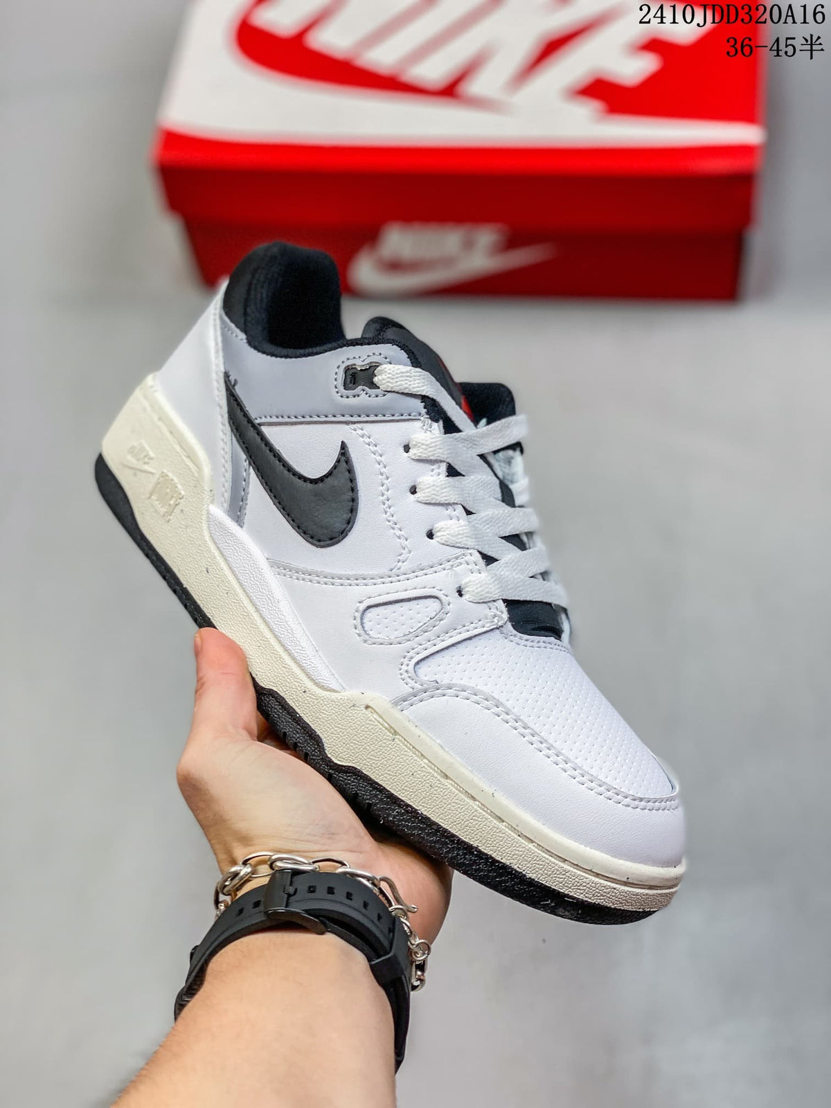 White and black Nike Full Force Low sneaker shown with a red Nike shoebox in the background; the image also displays style code 2410JDD320A16 and the size range 36–45.5.