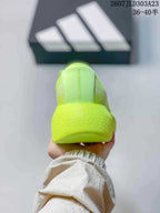 Rear view showing the padded heel and neon yellow-green upper.