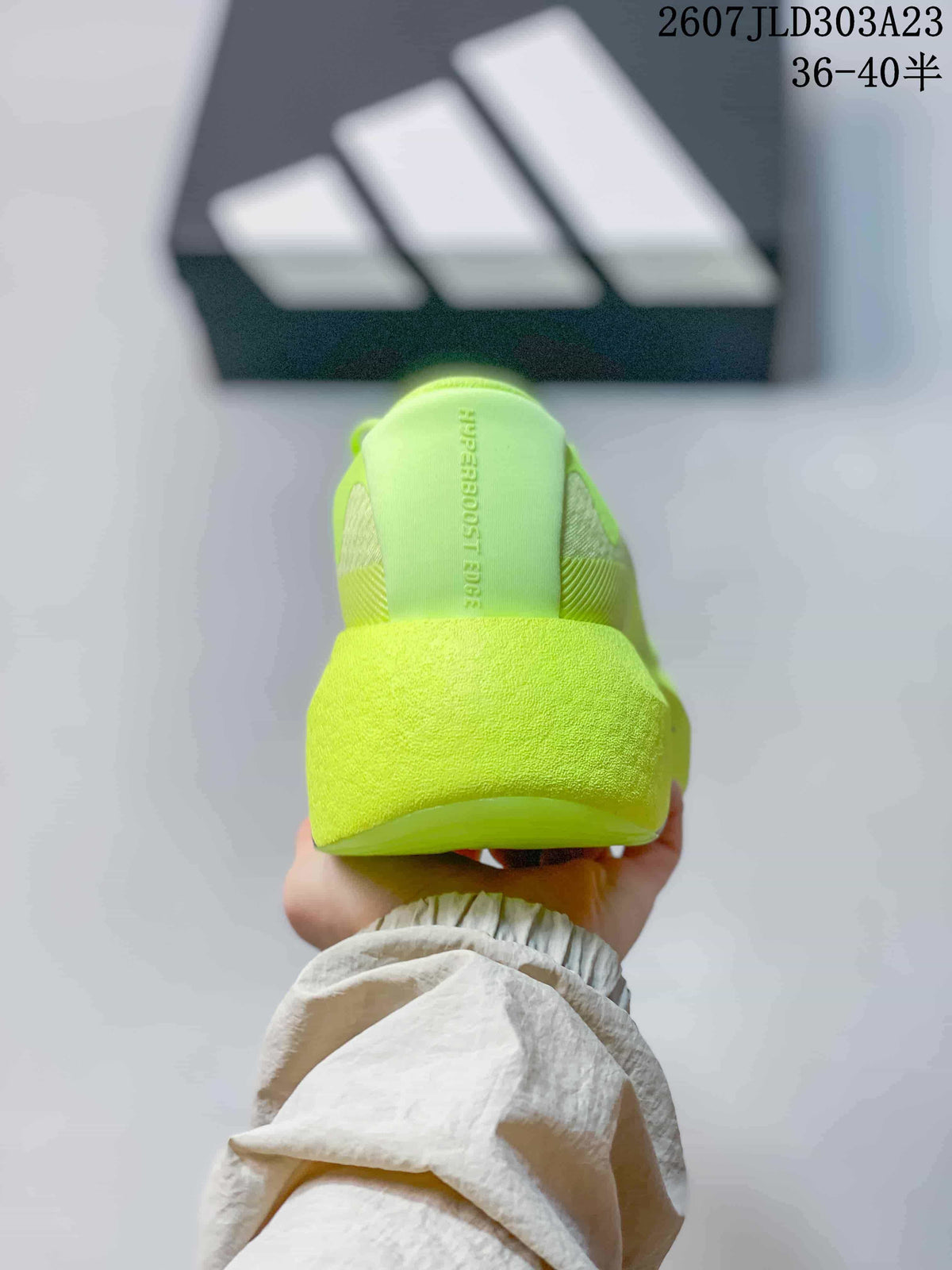 Rear view showing the padded heel and neon yellow-green upper.