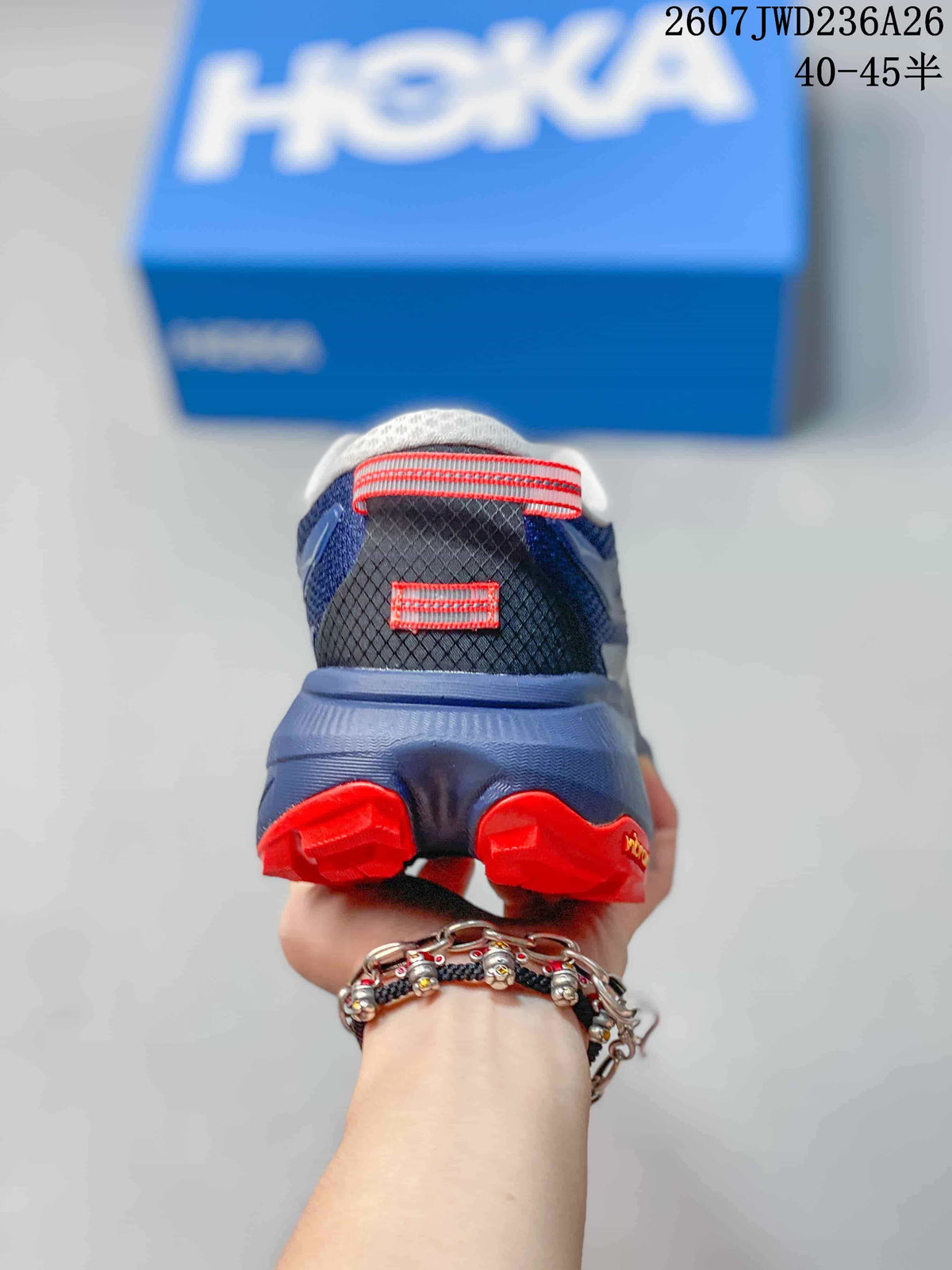 Rear view showing the padded collar, heel pull tab, and red outsole sections.