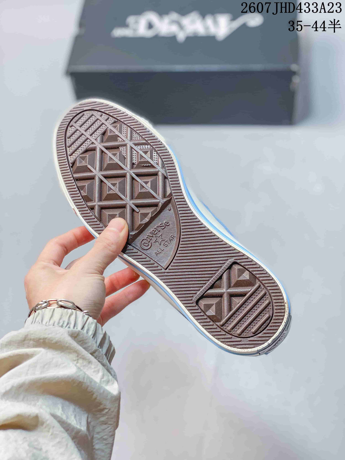 Close view of the textured rubber outsole with Converse All Star branding.