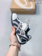 Side view of an ASICS HYPERSYNC kids’ sneaker showing the layered side branding, lace closure and contrasting panels.