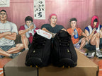 Front view of black lace-up basketball shoes with gold-tone accents.