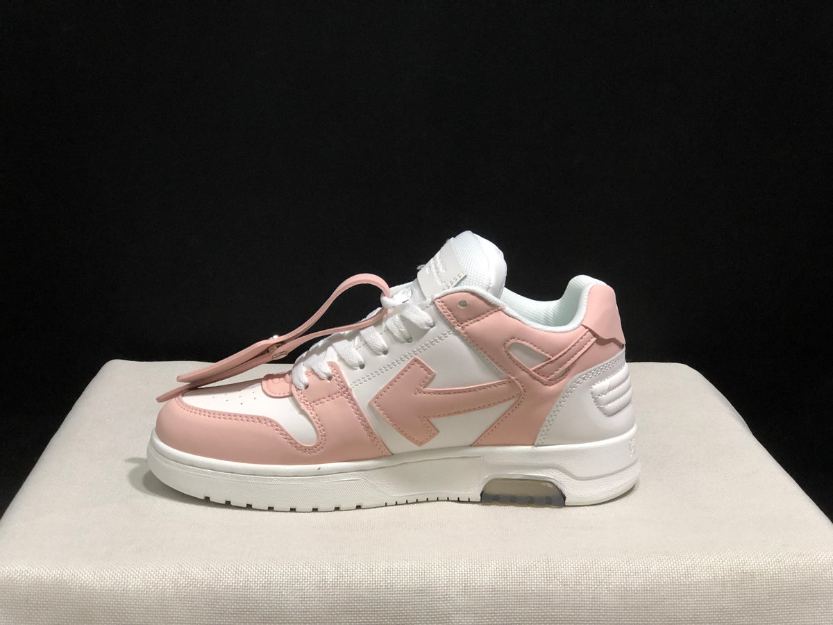 Side profile highlighting the low-top silhouette, layered panels, arrow motif, and segmented outsole.