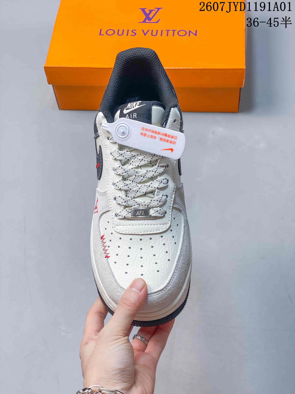 Front view highlighting perforated toe, patterned laces, and red accents