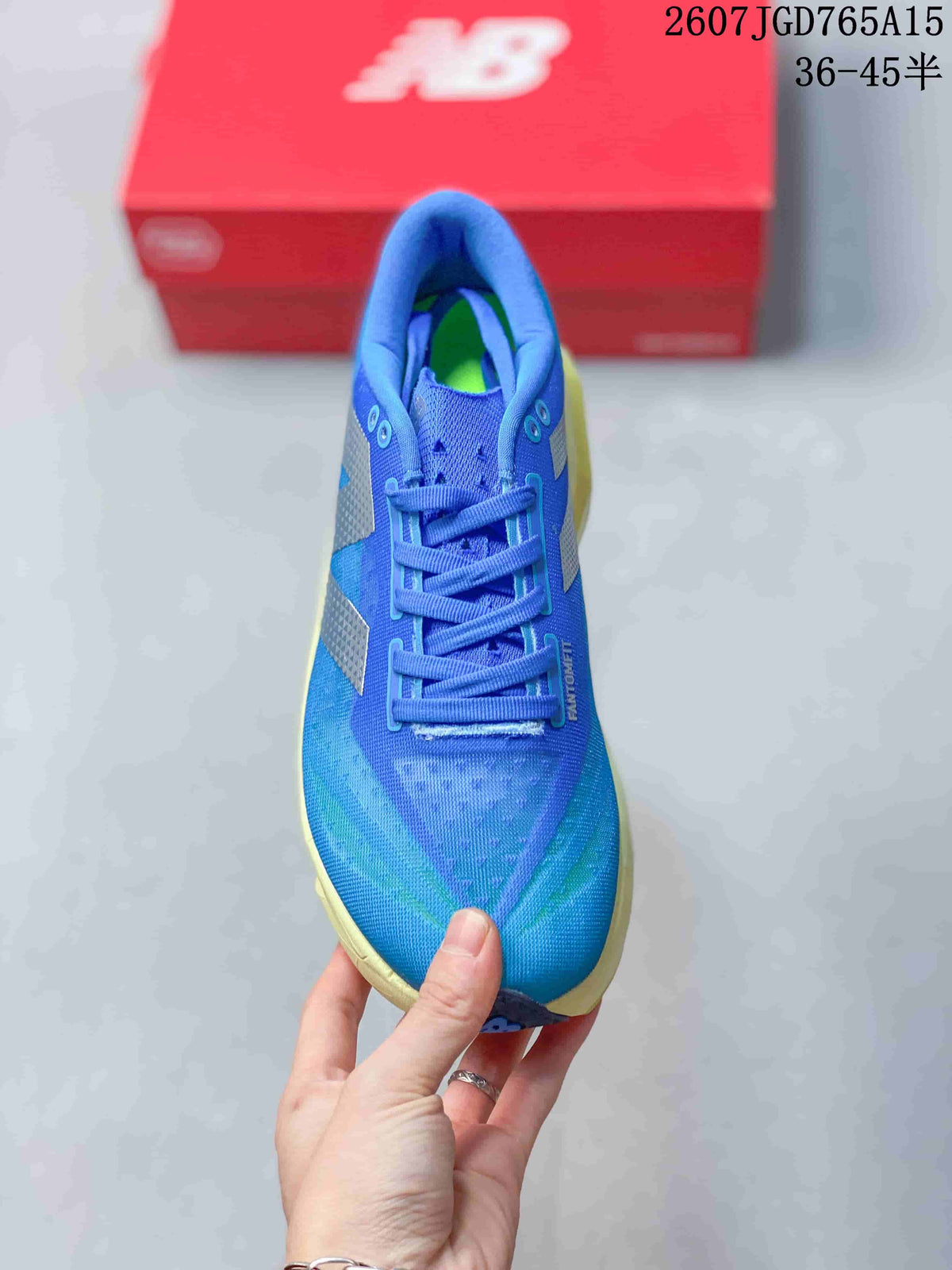 Top view of the blue lace-up running shoe showing the perforated toe area, blue tongue, and contrasting green insole detail.
