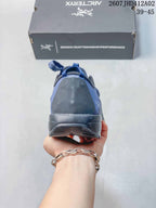 Rear view showing the heel and outsole of the blue shoe
