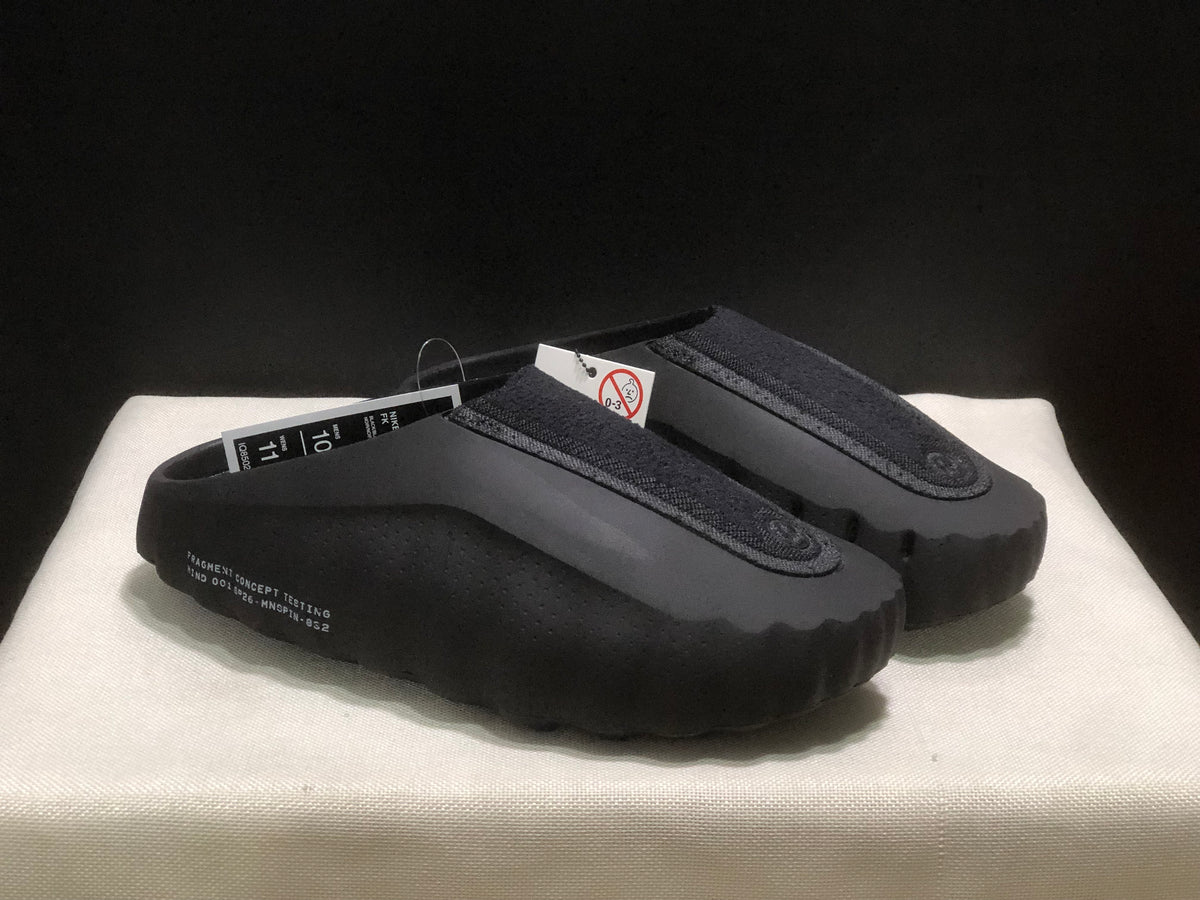 Three-quarter view of the black pair highlighting the textured upper and thick sculpted outsole.