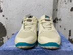 Front view showing the mesh toe areas, laces, and teal accents on Nike Ja 1 shoes