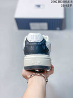 Rear view of the sneaker showing the navy heel panel, white padded collar, and MLB branding on the sole.