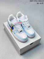 Pair of white and light blue Nike Air Force 1 '07 low-top sneakers displayed on a shoebox, with a visible size range marking of 36–45.