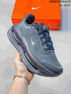 Angled side view of a black Nike Vomero Premium SP shoe with a small Swoosh