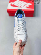 Top view showing the perforated white toe box, white laces, blue tongue label, and black padded collar.