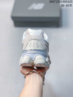 Rear view showing the padded heel, layered heel structure, and outsole.