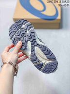 Close view of the ASICS sneaker outsole showing a segmented, patterned tread in dark grey and white; image text shows style code 1125A25 and size range 36–45.