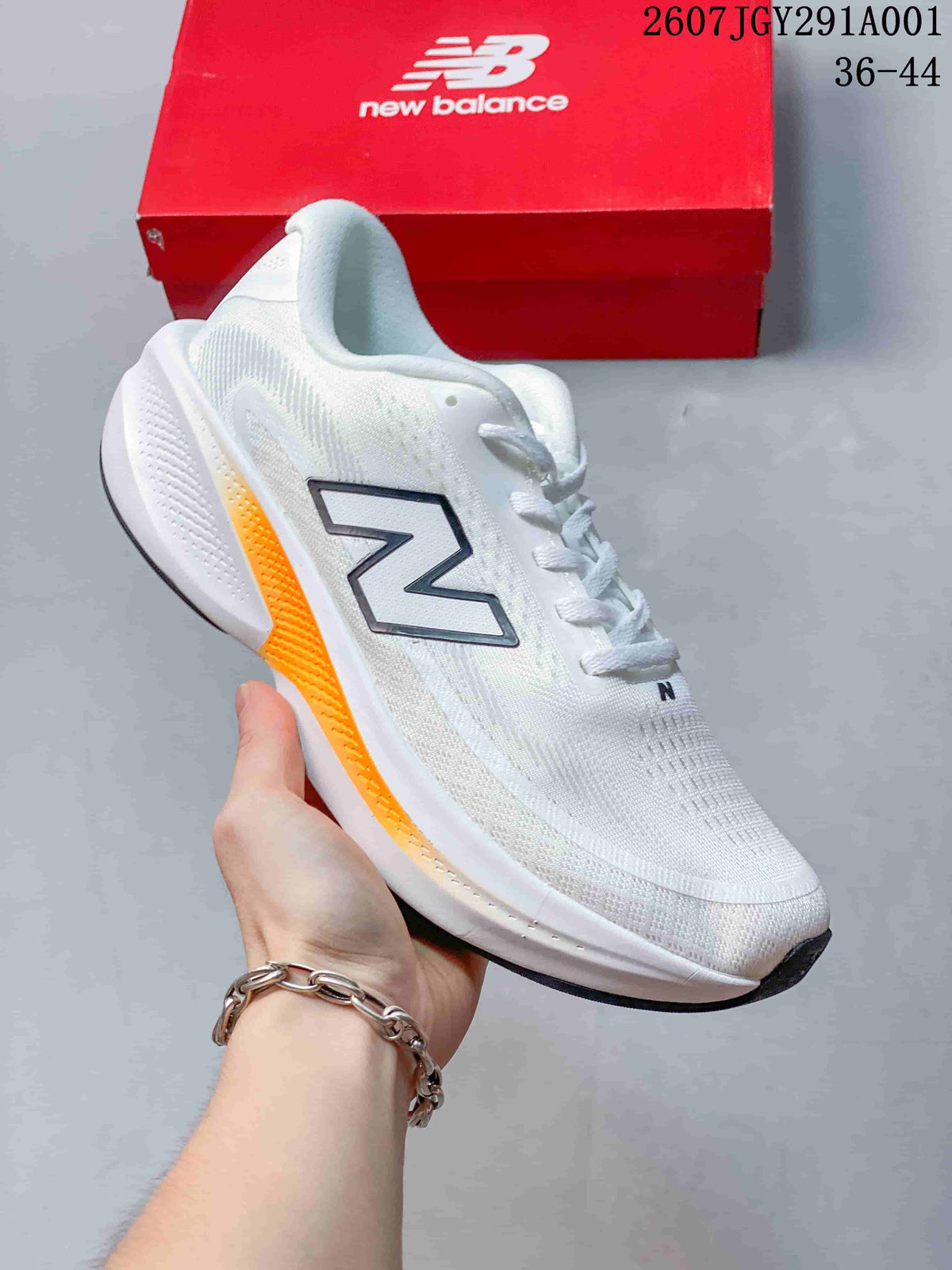 White New Balance running shoe with orange accents and a white sole.