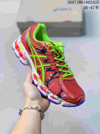 Angled side view showing the red and neon green upper, mesh panels and contrasting outsole.