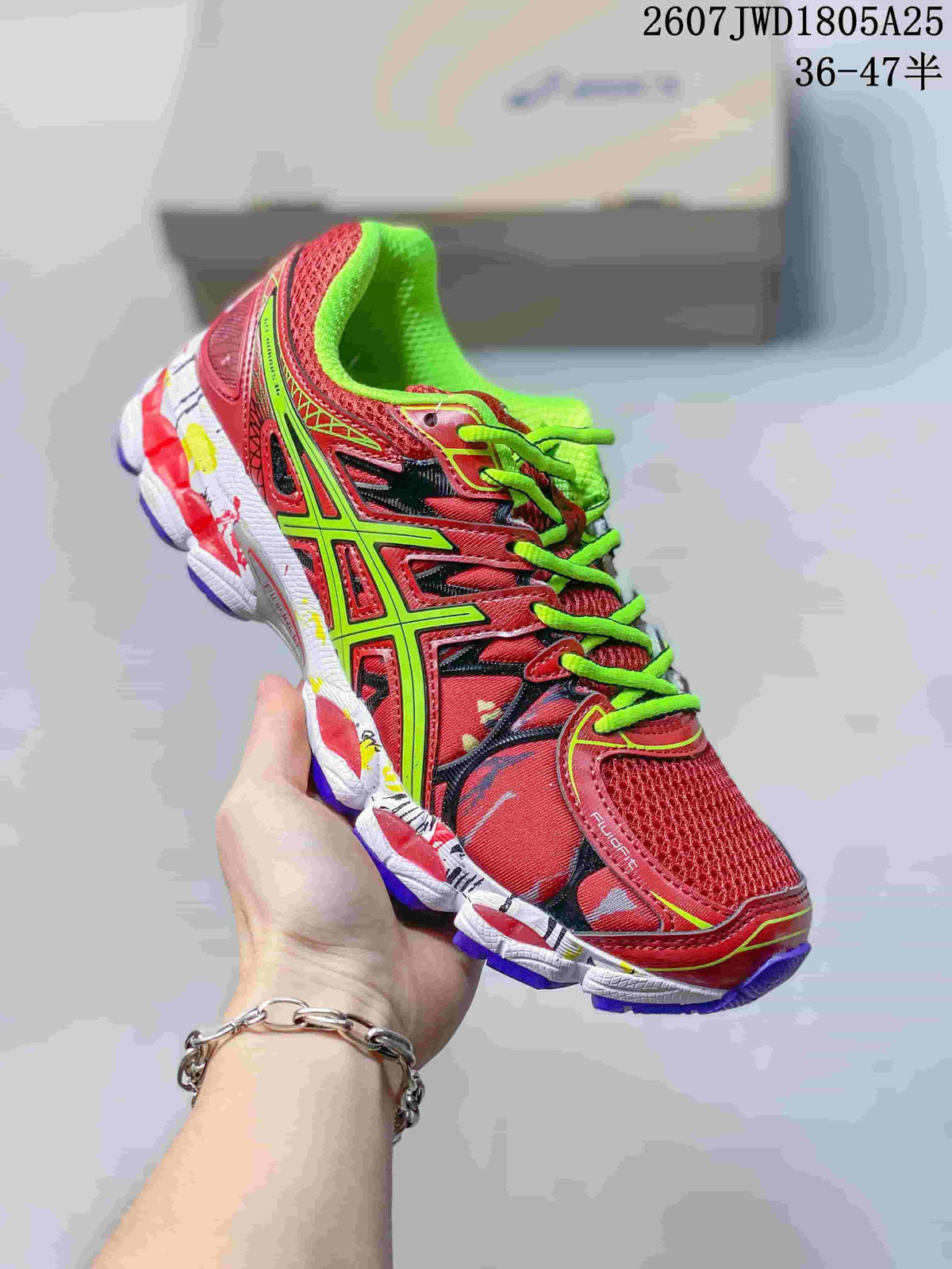 Angled side view showing the red and neon green upper, mesh panels and contrasting outsole.