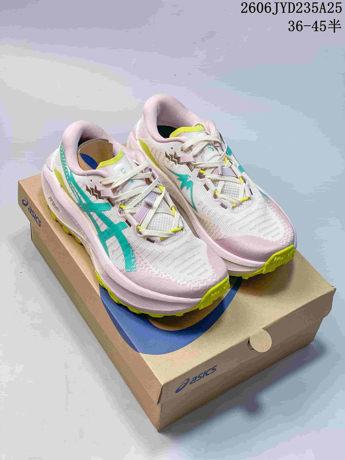 Light pink ASICS GEL-TRABUCO MAX 5 shoes with teal and lime accents on a shoe box