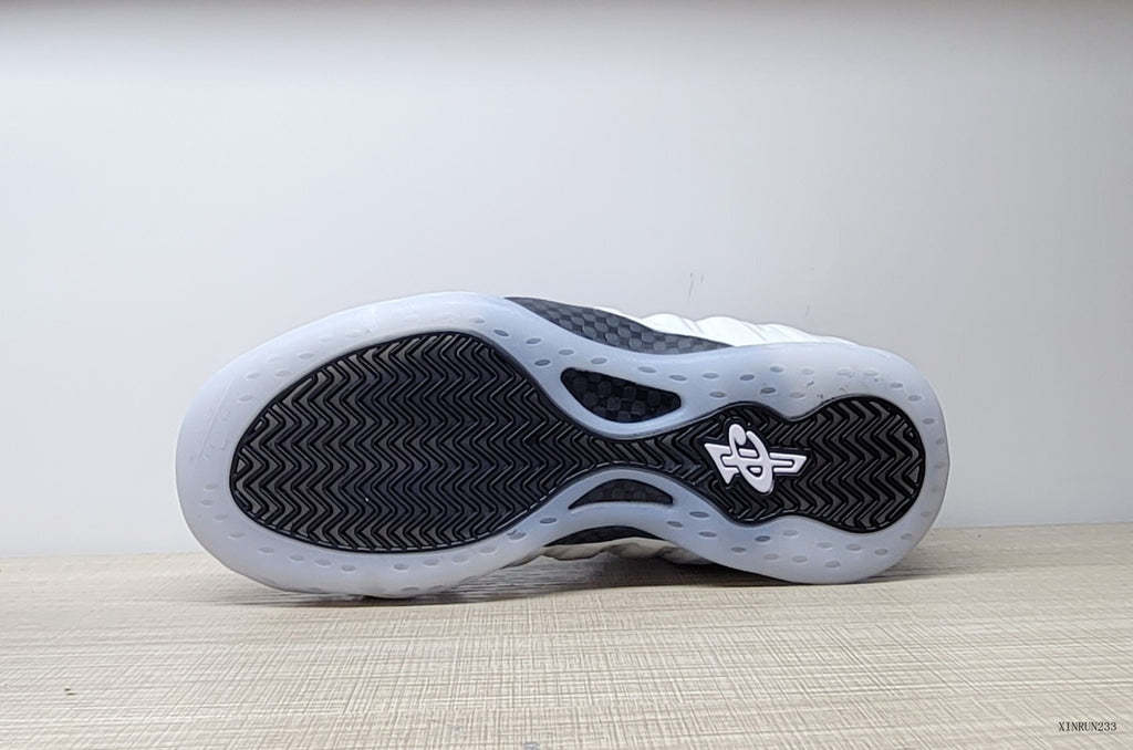 Outsole view showing the patterned tread on a Nike Little Posite One GS sneaker