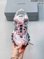 Top view of a Balenciaga Track 2 sneaker with pink laces and a visible tongue label; an image overlay shows a 36–45 size range.