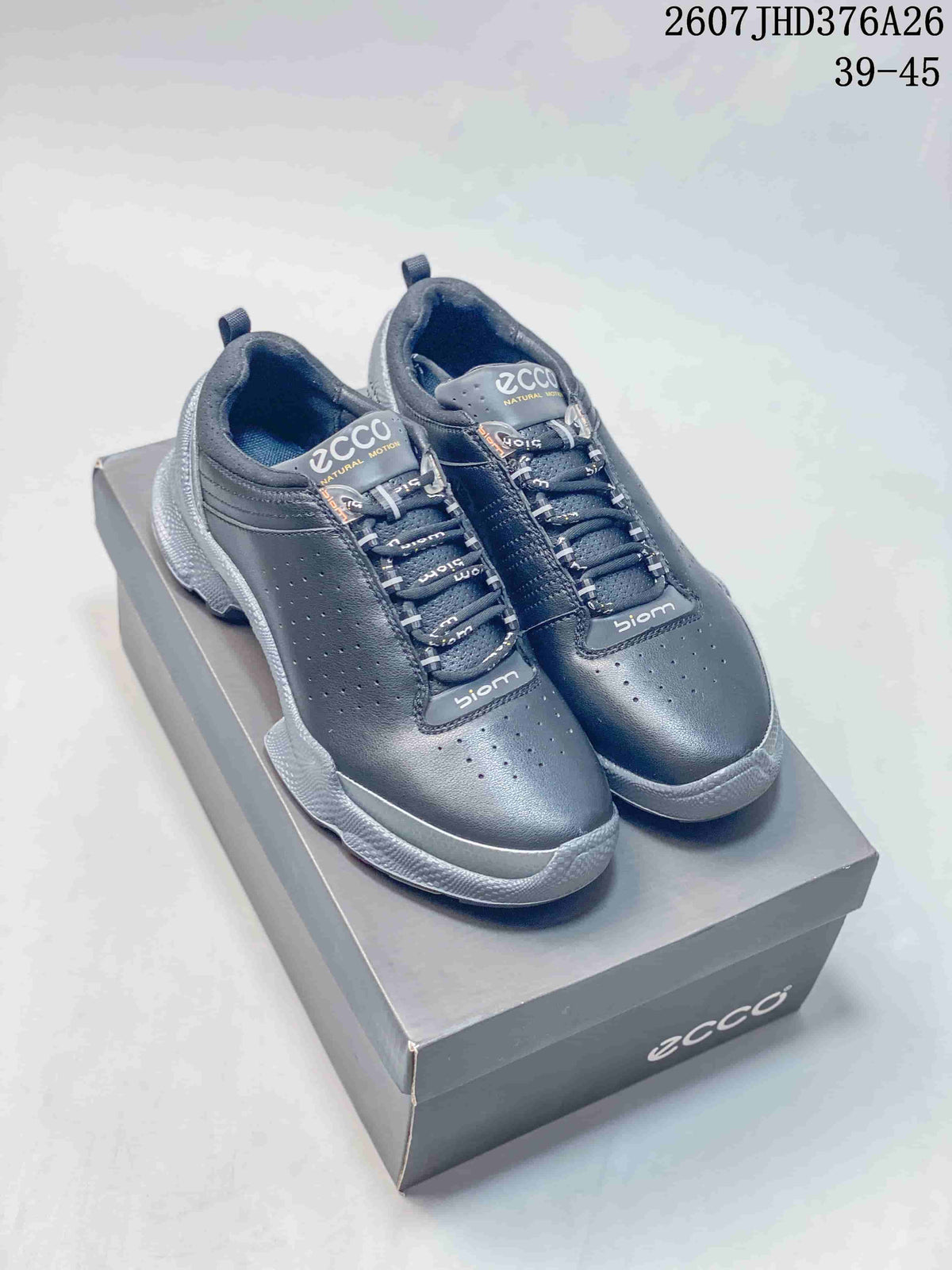 Pair of black and gray ECCO BIOM sneakers displayed on an ECCO shoe box; product code 2607 JHD376A26 and size range 39–45 are visible.