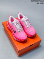 Pair of pink and red Nike Vomero Plus sneakers displayed on an orange shoebox; image text shows style code 2607JXD978A18 and size range 36–40.