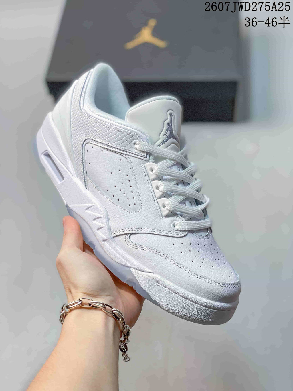 Angled close-up showing the white low-top construction, side panel and outsole details.