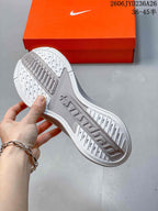 Underside of a Nike Pegasus Plus shoe showing the patterned outsole.