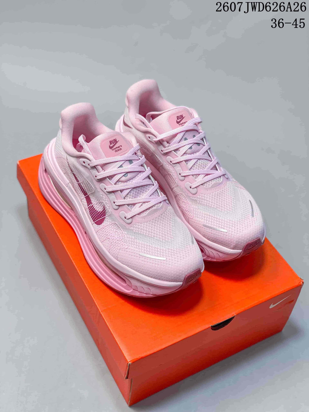 Pair of pink Nike Air Pegasus Premium sneakers displayed on an orange shoebox, with the text 2607JWD626A26 and 36–45 visible.