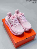 Pair of pink Nike Air Pegasus Premium sneakers displayed on an orange shoebox, with the text 2607JWD626A26 and 36–45 visible.