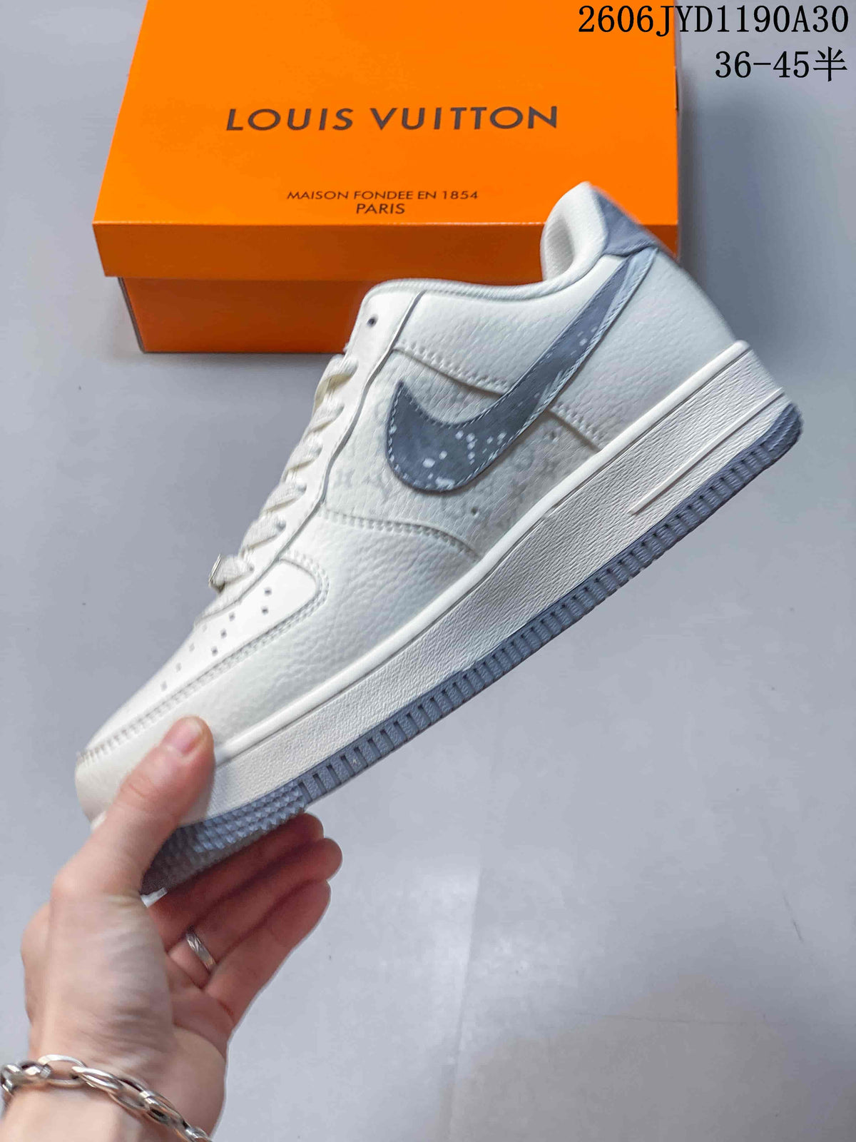 Side view of the off-white sneaker with gray Swoosh panel and patterned details