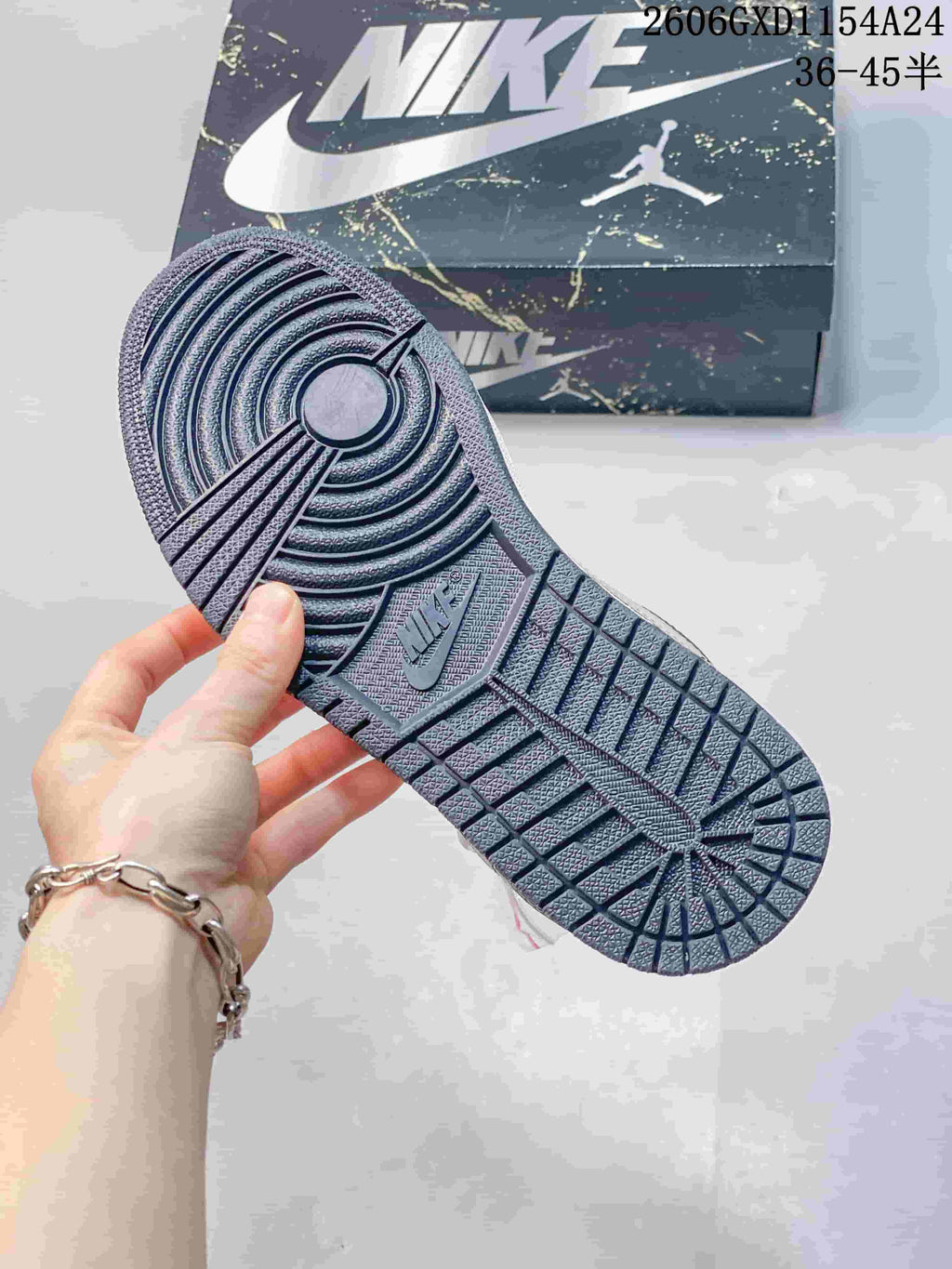 Navy outsole with circular and geometric tread pattern