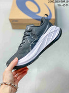 Side profile showing the dark mesh upper, white midsole and black outsole of the running sneaker.