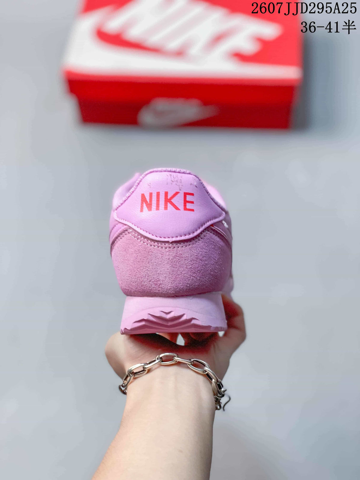 Rear view showing the pink heel and red Nike logo detail.