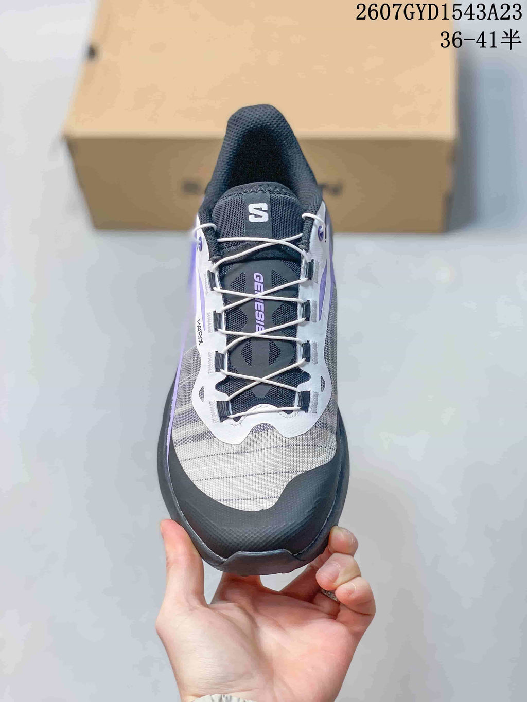 Top view of a Salomon Genesis shoe showing the lace-up closure, mesh-style upper, and protective toe area.