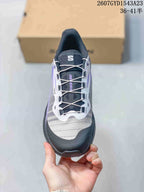 Top view of a Salomon Genesis shoe showing the lace-up closure, mesh-style upper, and protective toe area.
