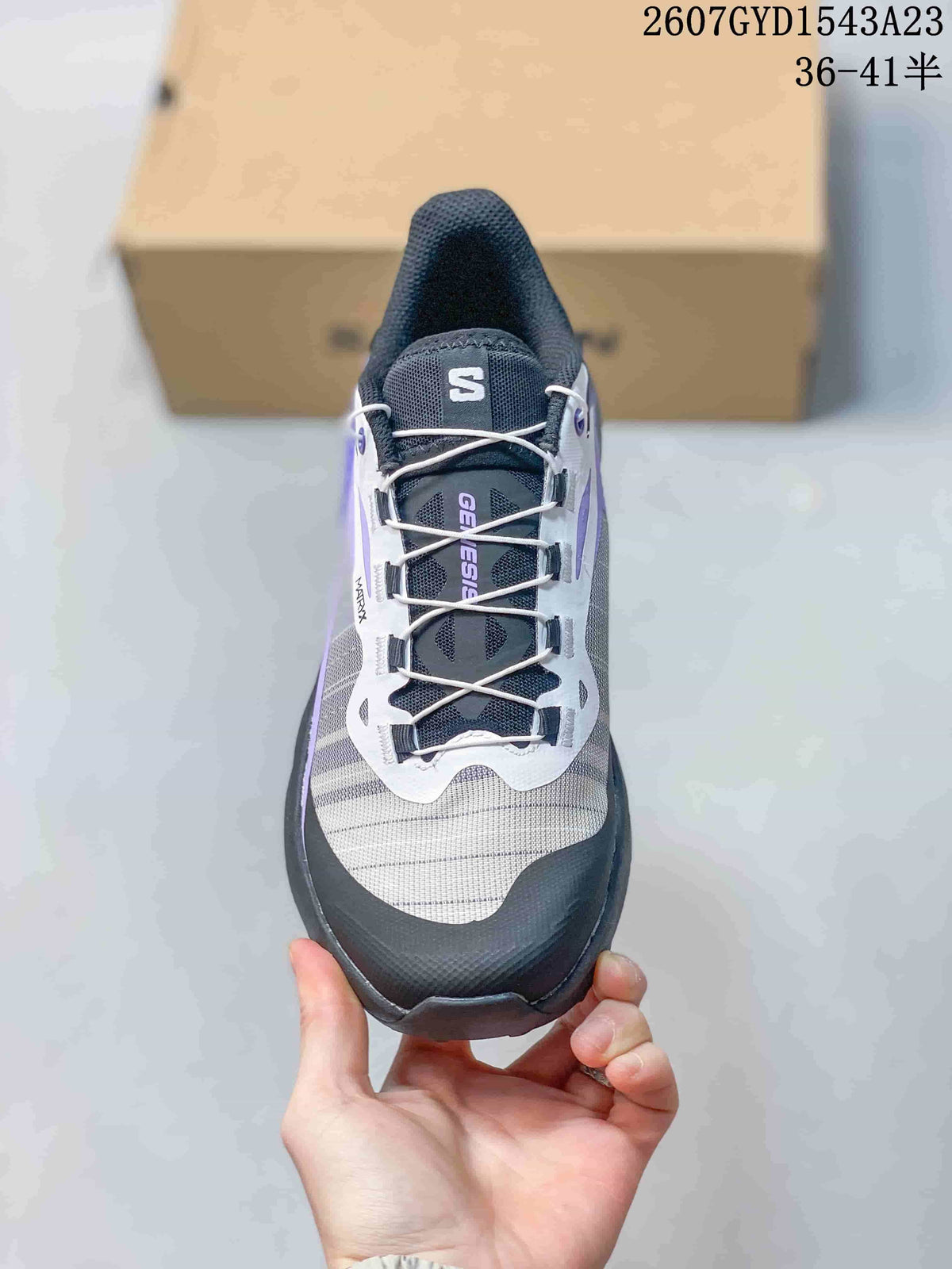 Top view of a Salomon Genesis shoe showing the lace-up closure, mesh-style upper, and protective toe area.