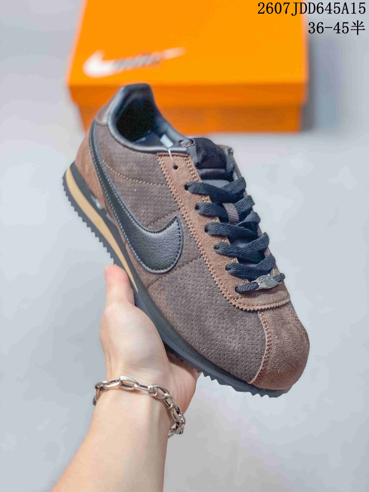 Angled side view of the brown and black low-top sneaker showing the Swoosh, laces, padded collar, and textured outsole.